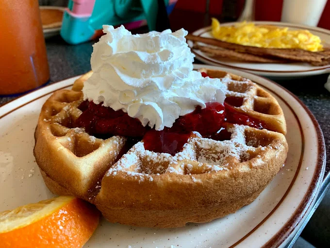 Strawberry waffle with whipped cream