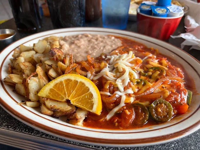 Huevos rancheros with potatoes and beans
